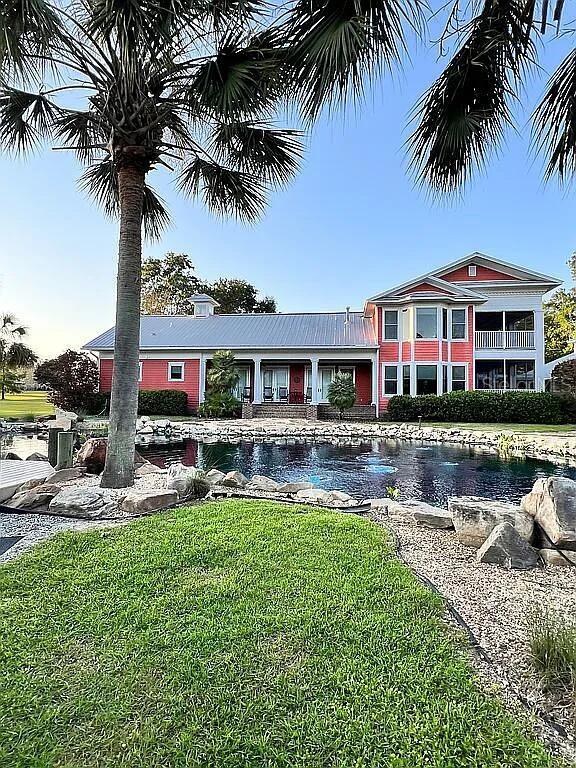 11317 NW 199th Ave, Alachua, FL 32615 - view of front of home with a front yard and a chimney