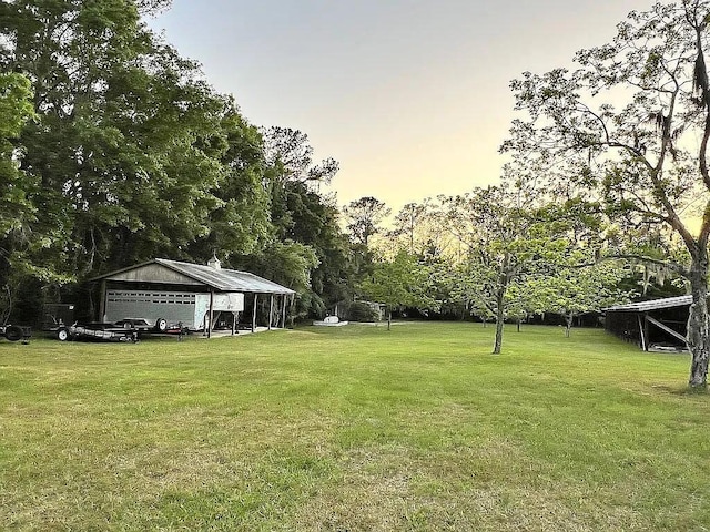 11317 NW 199th Ave, Alachua, FL 32615 - view of grassy yard featuring a detached garage