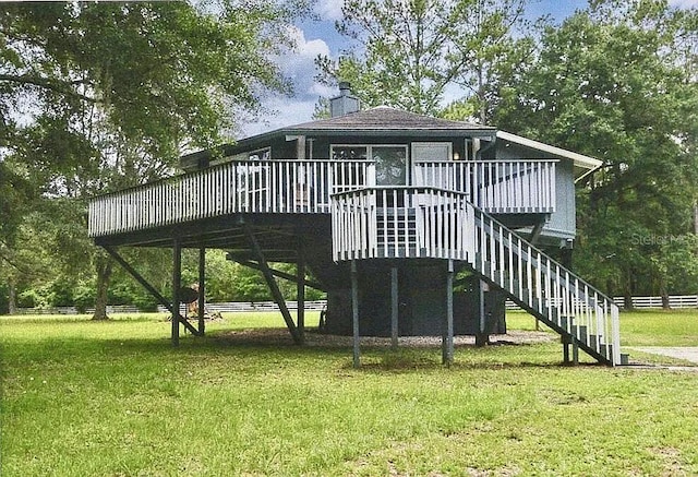 11317 NW 199th Ave, Alachua, FL 32615 - rear view of house with a chimney, a deck, and stairway