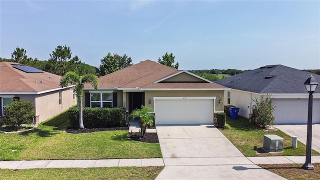 4553 Baler Trails Dr, Saint Cloud, FL 34772 - single story home with a front yard, a garage, concrete driveway, and stucco siding
