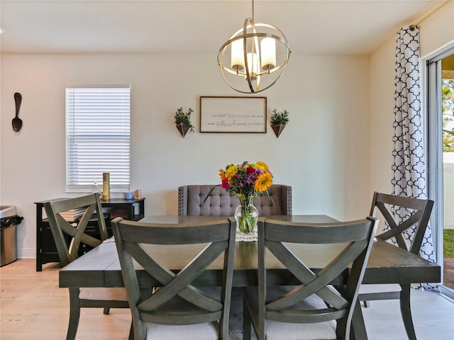 4553 Baler Trails Dr, Saint Cloud, FL 34772 - dining room with light wood-type flooring and a chandelier