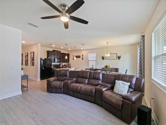 4553 Baler Trails Dr, Saint Cloud, FL 34772 - living area with a ceiling fan, light wood-style floors, baseboards, and recessed lighting