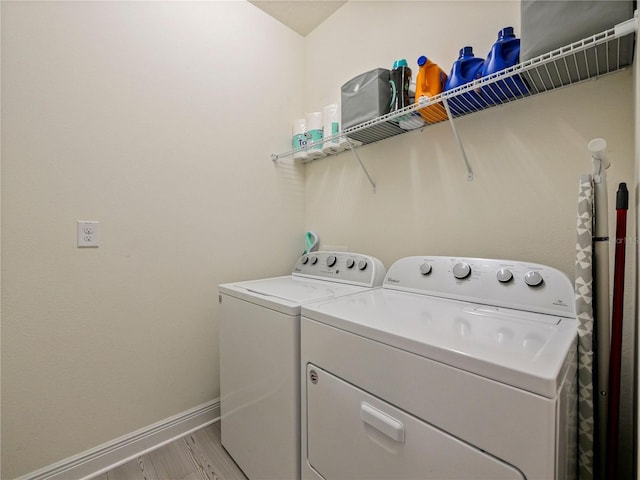 4553 Baler Trails Dr, Saint Cloud, FL 34772 - laundry area with separate washer and dryer, baseboards, and light wood-style floors