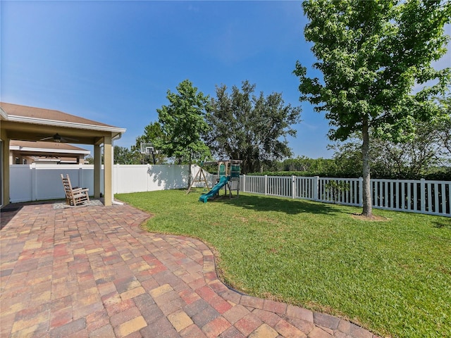 4553 Baler Trails Dr, Saint Cloud, FL 34772 - view of yard featuring a playground, a patio, and ceiling fan