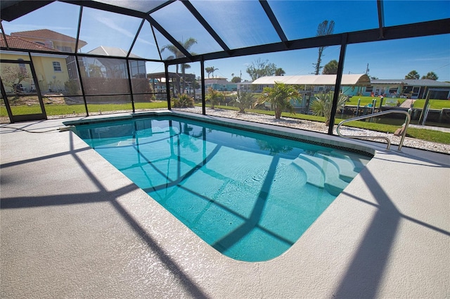 1933 Oregon Trl, Englewood, FL 34224 - outdoor pool featuring a residential view, glass enclosure, and a patio area
