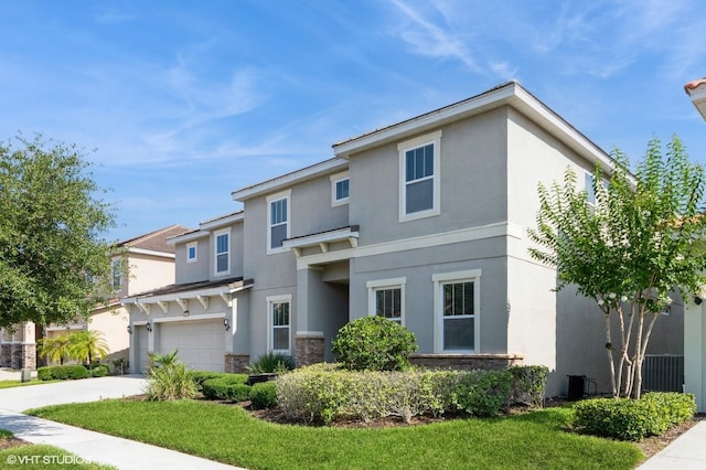 7017 Oakwood St, Davenport, FL 33837 - view of front facade featuring stucco siding, concrete driveway, stone siding, and a garage