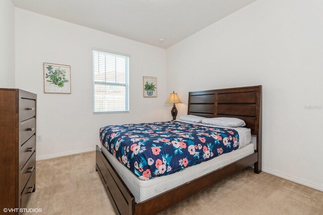 7017 Oakwood St, Davenport, FL 33837 - bedroom with light carpet and baseboards