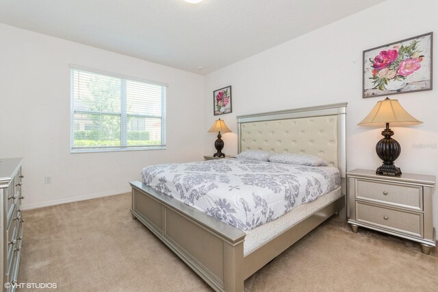 7017 Oakwood St, Davenport, FL 33837 - bedroom featuring light colored carpet and baseboards