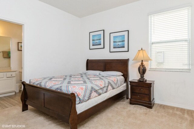 7017 Oakwood St, Davenport, FL 33837 - bedroom featuring light colored carpet and baseboards