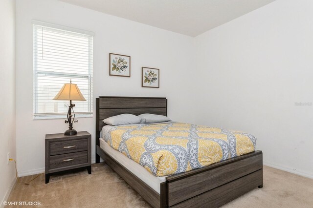 7017 Oakwood St, Davenport, FL 33837 - carpeted bedroom featuring baseboards