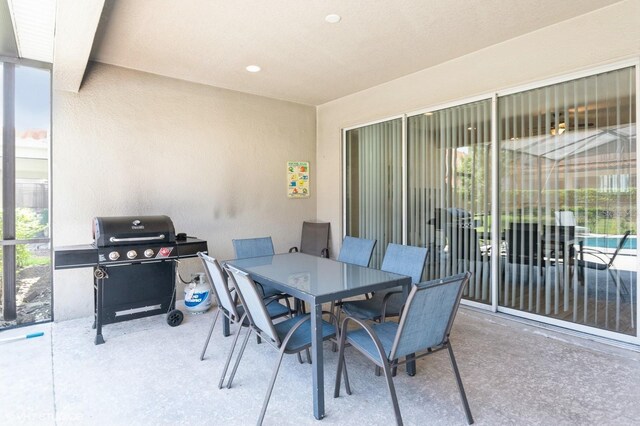 7017 Oakwood St, Davenport, FL 33837 - view of patio / terrace with a grill and outdoor dining space