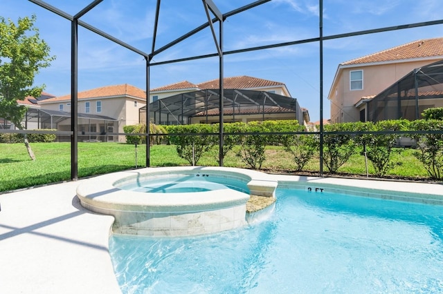 7017 Oakwood St, Davenport, FL 33837 - view of pool with glass enclosure, a pool with connected hot tub, and a lawn