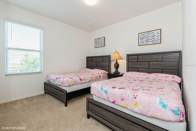 7017 Oakwood St, Davenport, FL 33837 - bedroom featuring carpet floors and baseboards