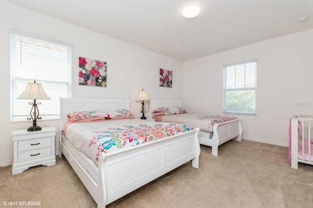 7017 Oakwood St, Davenport, FL 33837 - bedroom featuring light carpet