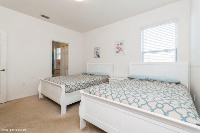 7017 Oakwood St, Davenport, FL 33837 - bedroom with light colored carpet