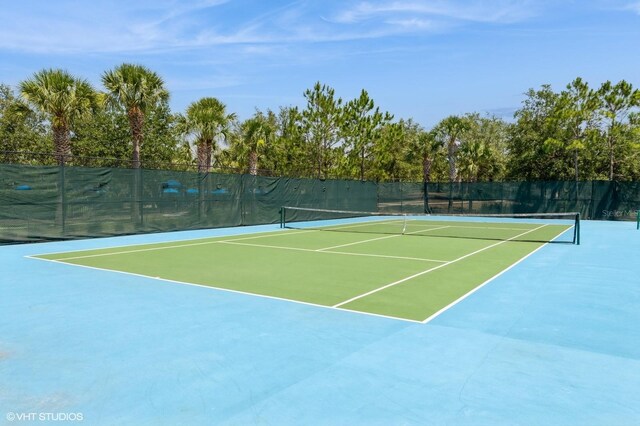 7017 Oakwood St, Davenport, FL 33837 - view of tennis court featuring community basketball court