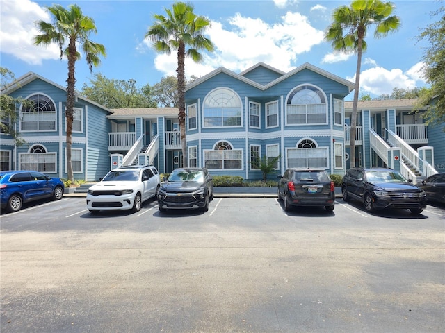 3157 Britannia Blvd Unit B, Kissimmee, FL 34747 - view of building exterior featuring uncovered parking and stairs