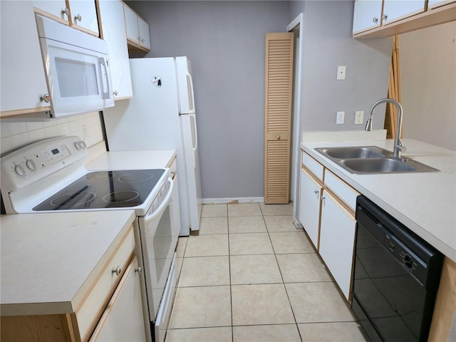 3157 Britannia Blvd Unit B, Kissimmee, FL 34747 - kitchen with white appliances, a sink, light countertops, and light tile patterned floors