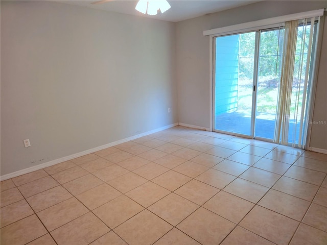 3157 Britannia Blvd Unit B, Kissimmee, FL 34747 - unfurnished room featuring plenty of natural light, light tile patterned floors, baseboards, and ceiling fan