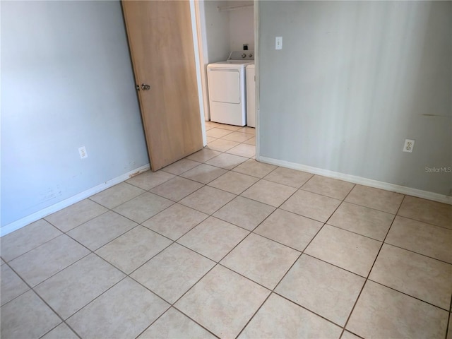 3157 Britannia Blvd Unit B, Kissimmee, FL 34747 - unfurnished room with washing machine and clothes dryer, light tile patterned floors, and baseboards