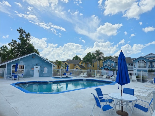 3157 Britannia Blvd Unit B, Kissimmee, FL 34747 - community pool with a patio area and a residential view