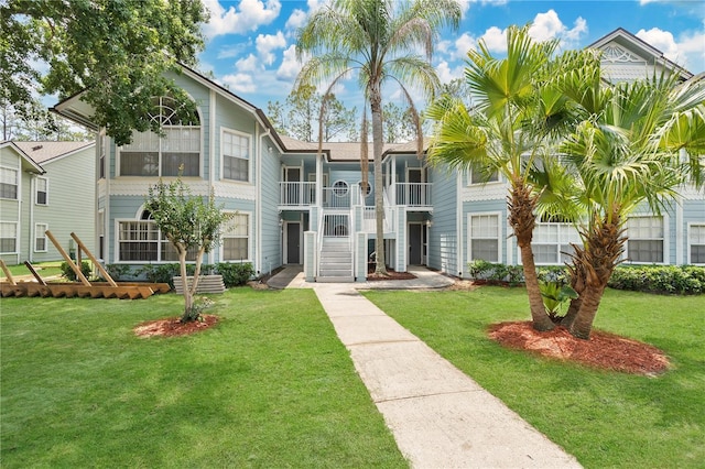 2020 Royal Bay Blvd Unit 91, Kissimmee, FL 34746 - view of front of house with a front yard and stairs