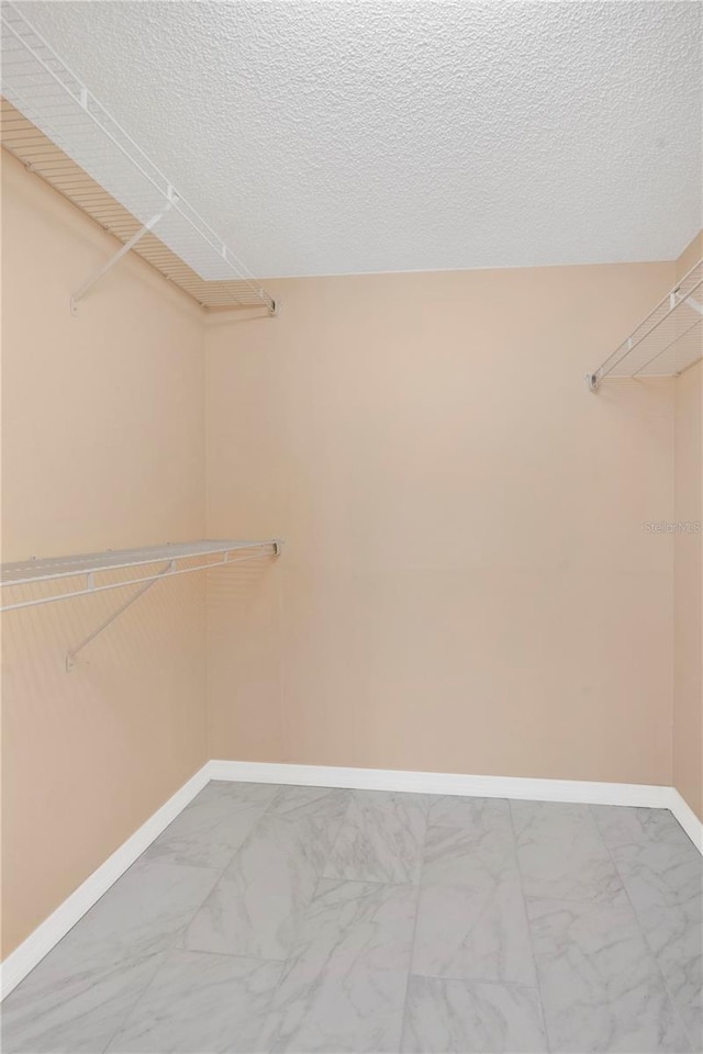 2020 Royal Bay Blvd Unit 91, Kissimmee, FL 34746 - walk in closet with marble finish floors