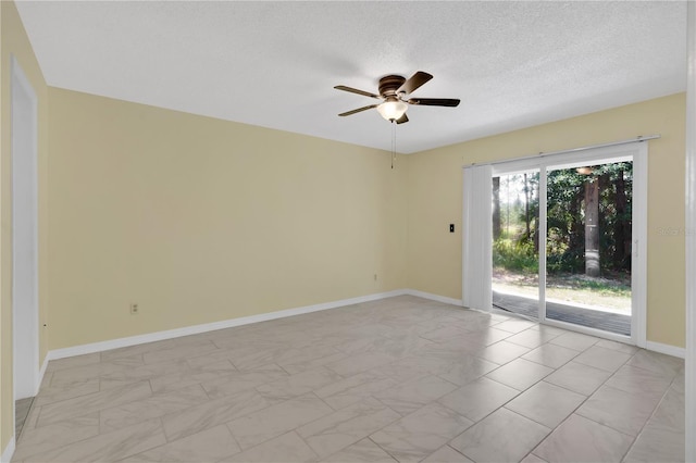 2020 Royal Bay Blvd Unit 91, Kissimmee, FL 34746 - empty room with light marble finish flooring, a ceiling fan, baseboards, and a textured ceiling
