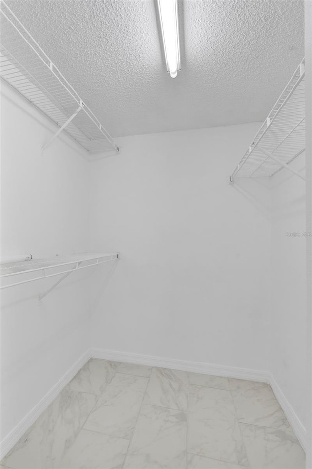 2020 Royal Bay Blvd Unit 91, Kissimmee, FL 34746 - spacious closet with light marble finish floors