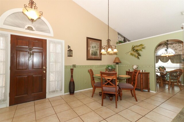 2021 Wildfire Ct, Apopka, FL 32703 - tiled dining room featuring a chandelier and high vaulted ceiling