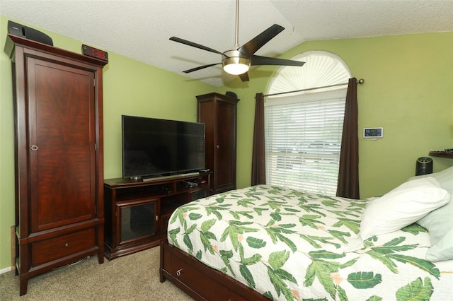 2021 Wildfire Ct, Apopka, FL 32703 - bedroom with vaulted ceiling, light colored carpet, ceiling fan, and a textured ceiling