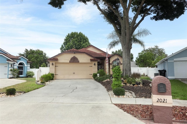 2021 Wildfire Ct, Apopka, FL 32703 - single story home featuring stucco siding, a gate, and concrete driveway