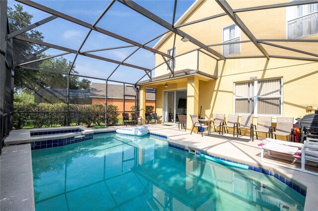 17614 Woodcrest Way, Clermont, FL 34714 - view of swimming pool with a patio, a pool with connected hot tub, and a lanai