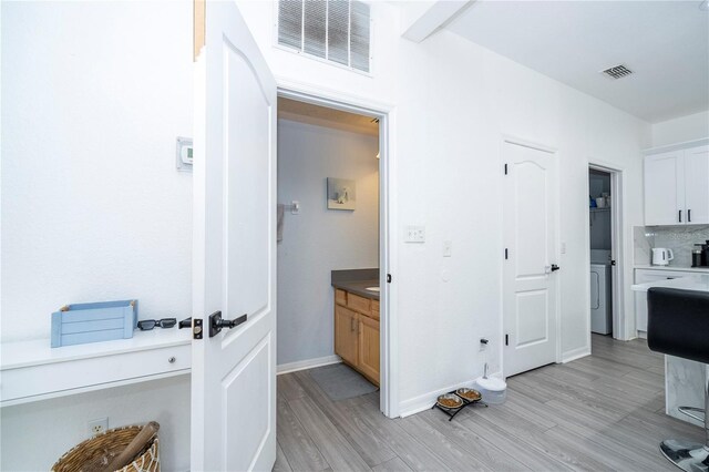17614 Woodcrest Way, Clermont, FL 34714 - corridor featuring light wood-style flooring and baseboards