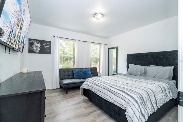 17614 Woodcrest Way, Clermont, FL 34714 - bedroom featuring wood finished floors