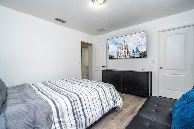 17614 Woodcrest Way, Clermont, FL 34714 - bedroom featuring wood finished floors