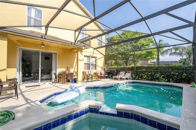 17614 Woodcrest Way, Clermont, FL 34714 - view of swimming pool featuring a patio, glass enclosure, and outdoor dining area