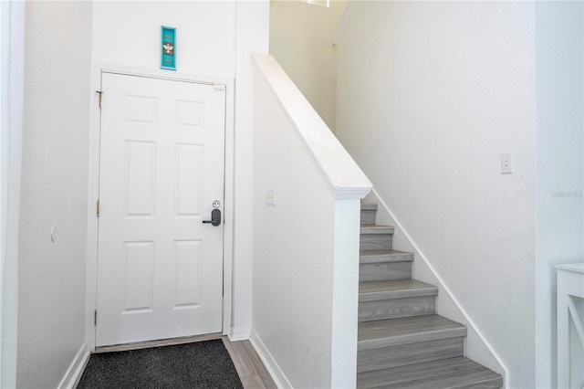 17614 Woodcrest Way, Clermont, FL 34714 - stairway with wood finished floors and baseboards