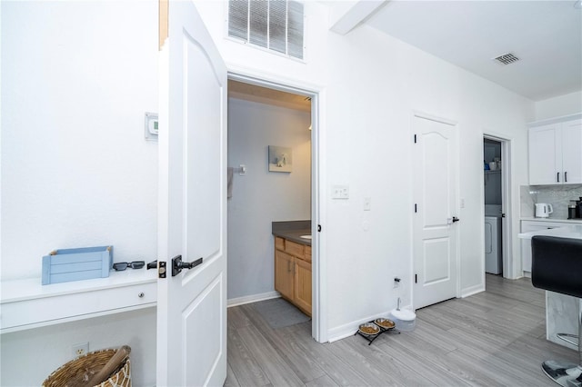 17614 Woodcrest Way, Clermont, FL 34714 - corridor featuring light wood-style flooring and baseboards