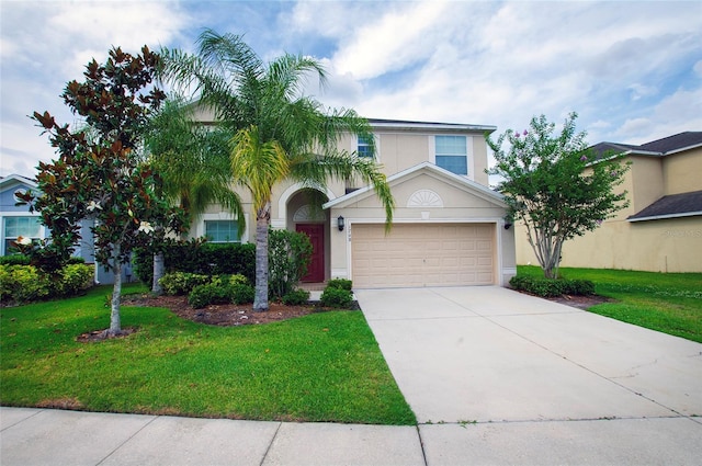 1748 Thetford Cir, Orlando, FL 32824 - view of front of home with driveway, stucco siding, a front lawn, and a garage