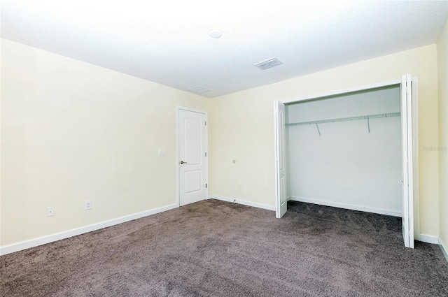 1748 Thetford Cir, Orlando, FL 32824 - unfurnished bedroom featuring carpet floors, baseboards, and a closet