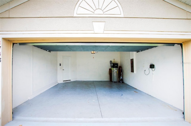 1748 Thetford Cir, Orlando, FL 32824 - garage with electric panel and water heater