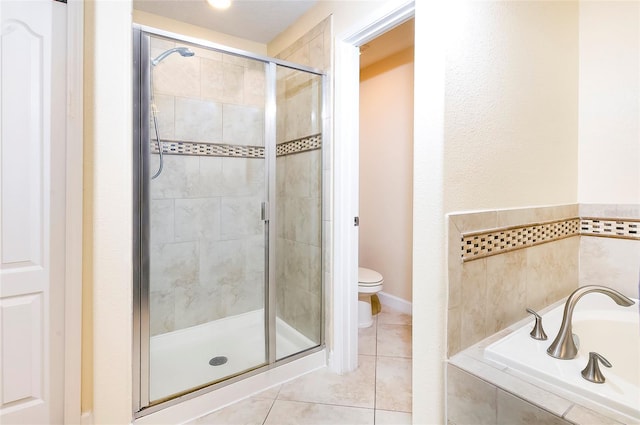 1748 Thetford Cir, Orlando, FL 32824 - bathroom with a stall shower, tile patterned flooring, a bath, and toilet