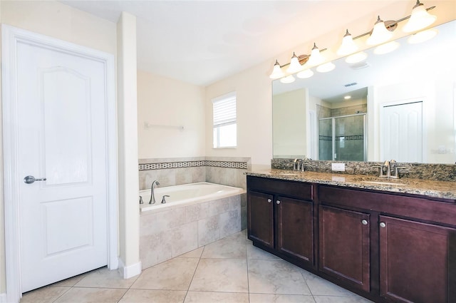 1748 Thetford Cir, Orlando, FL 32824 - full bathroom featuring a garden tub, a stall shower, tile patterned flooring, and double vanity
