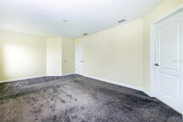 1748 Thetford Cir, Orlando, FL 32824 - spare room with dark colored carpet and baseboards