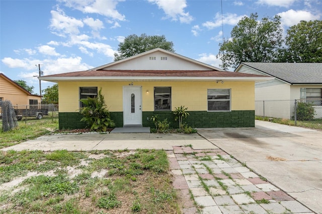 450 S Buena Vista Ave, Orlando, FL 32835 - view of front of house featuring concrete block siding and roof with shingles