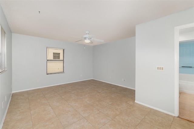 450 S Buena Vista Ave, Orlando, FL 32835 - spare room featuring ceiling fan and light tile patterned floors