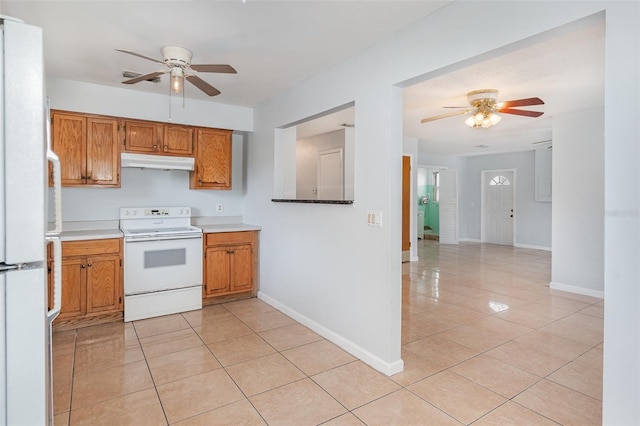 450 S Buena Vista Ave, Orlando, FL 32835 - kitchen featuring white appliances, under cabinet range hood, a ceiling fan, and light tile patterned flooring