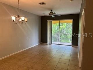 8775 Sartori St Unit 307, Orlando, FL 32829 - tiled spare room featuring a chandelier, ceiling fan, and baseboards
