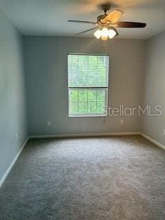 8775 Sartori St Unit 307, Orlando, FL 32829 - spare room featuring baseboards, carpet flooring, and ceiling fan